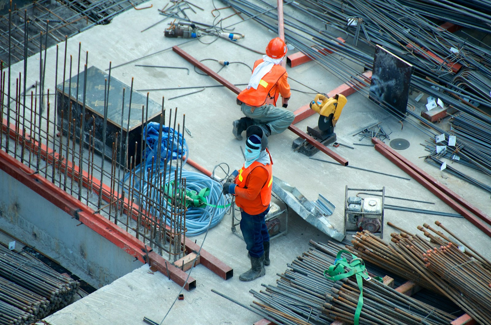 Site worker carrying materials on a build